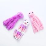 Three soft and colorful Plush Catnip Octopus Toys in pink, purple, and multicolored designs, perfect for playful cats.