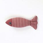 Red striped fish cat toy with zigzag pattern on a white background.